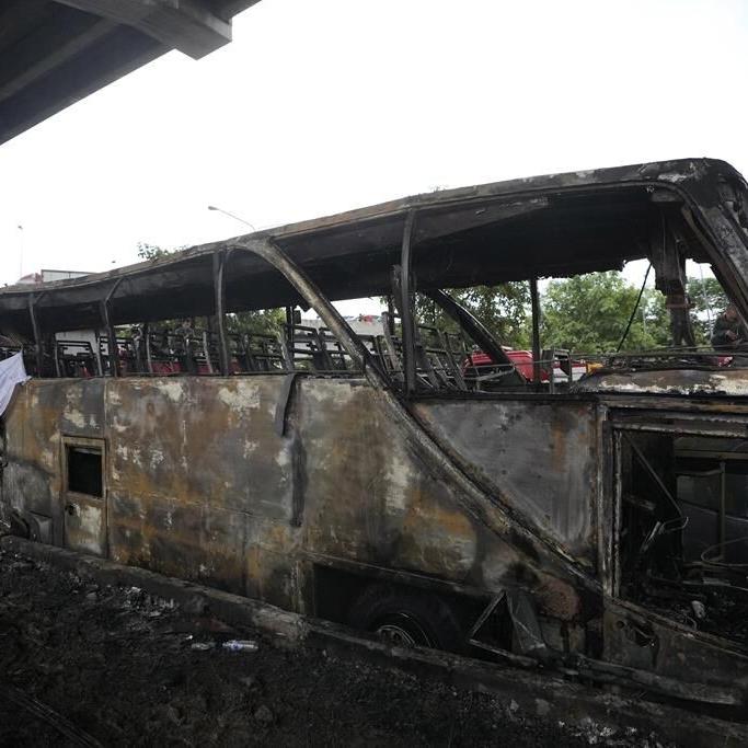 Operator of a Thai bus that caught fire and killed 23 is charged, as investigators suspect gas leak